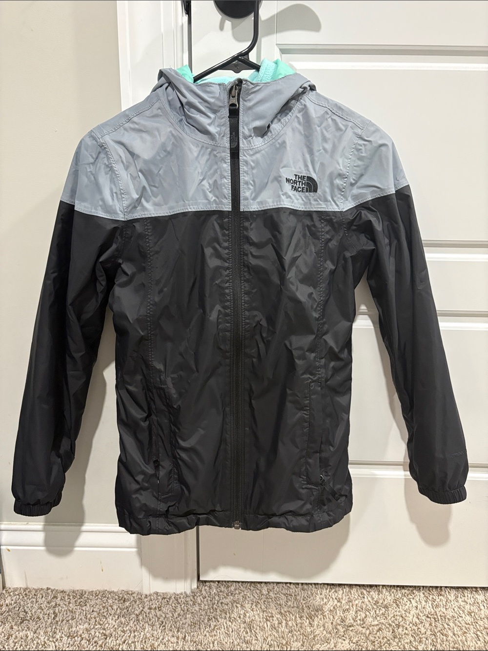 The North Face Kids Black and Light Gray Hooded Rain Jacket with Mint Lining